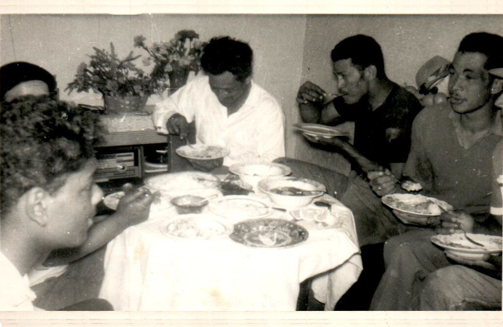 Workers from the Mosque having lunch on a Sunday